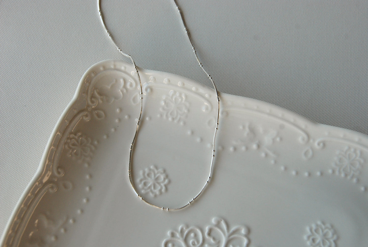 Collar Doble Pelotitas